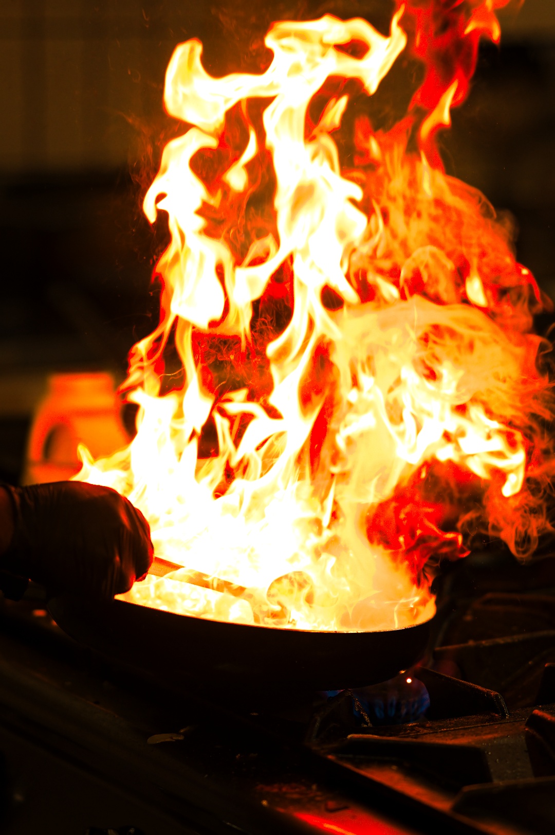 Expert Kerala chef cooking traditional South Indian food in Spice Route kitchen
